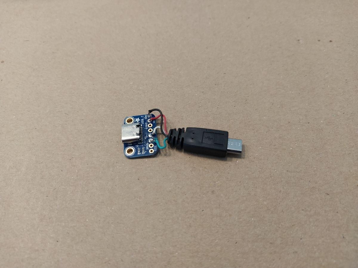 USB-C breakout board socket soldered to USB micro-B plug adapter