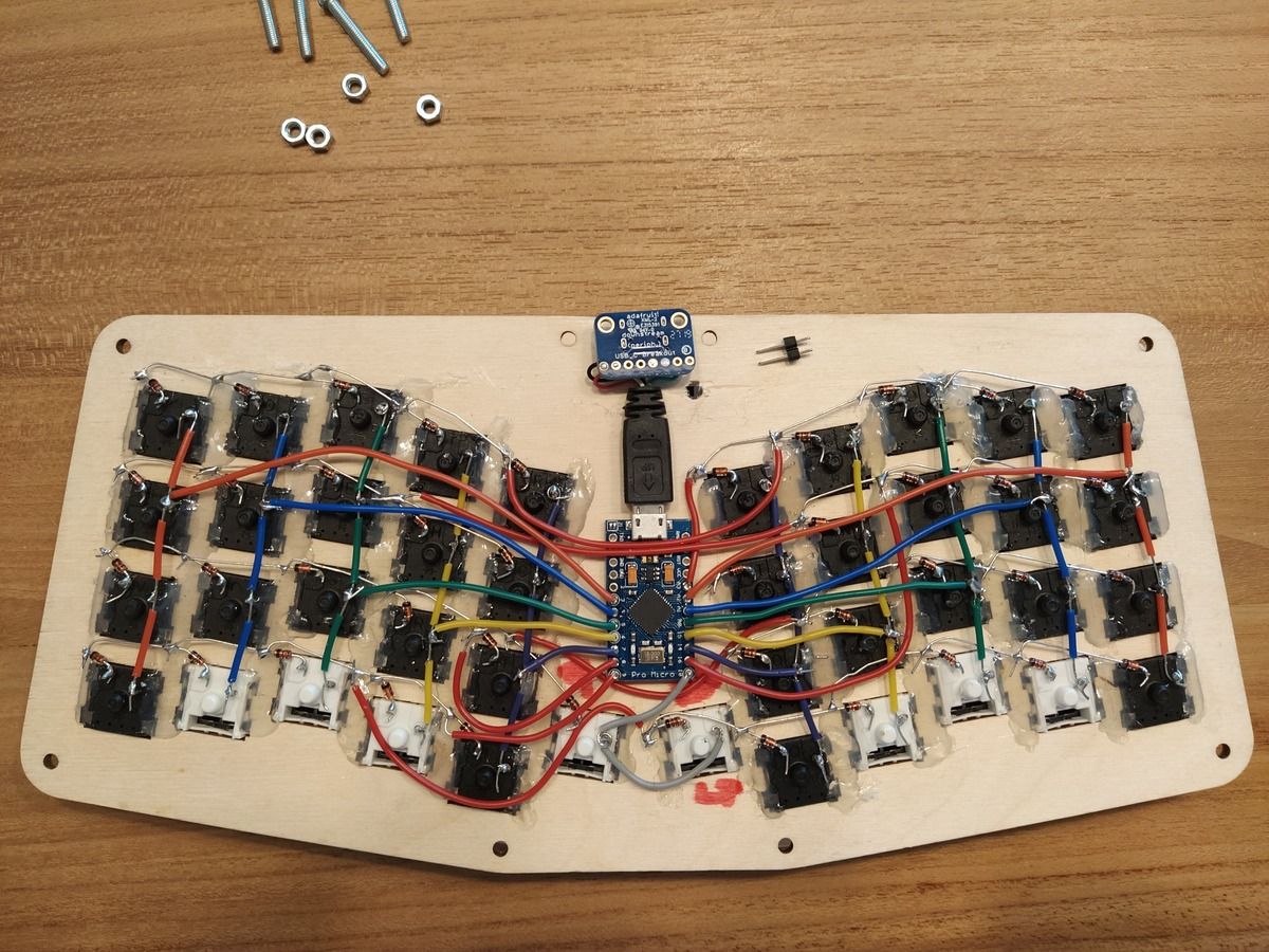 Drilled hole next to the USB-C breakout board area sized for two header pins