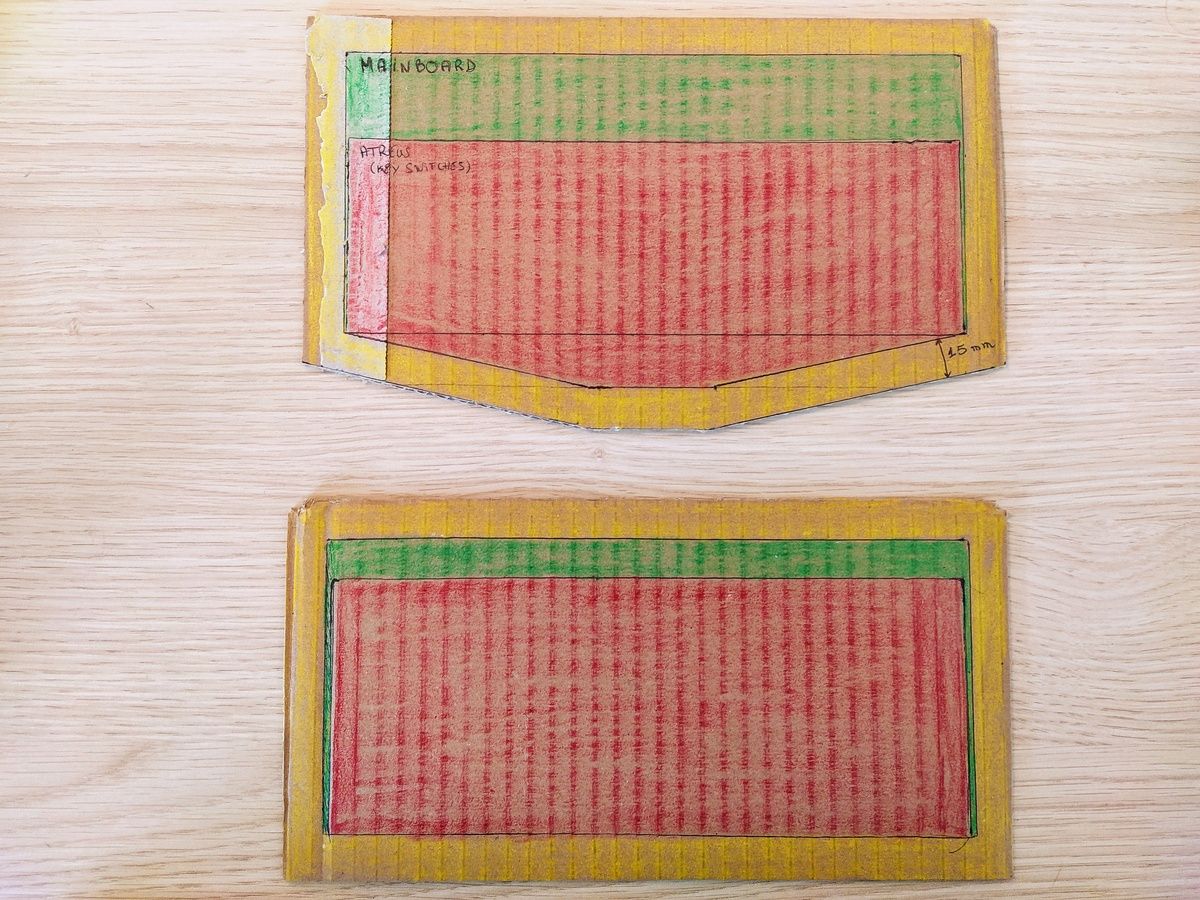 Two housing design options shown as colored rectangles on paper